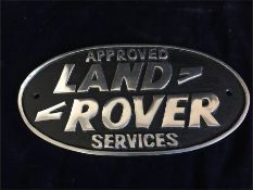 A Cast Iron Approved Services Land Rover Sign