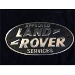 A Cast Iron Approved Services Land Rover Sign