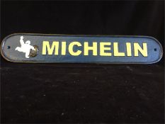 A Cast Iron Michelin sign