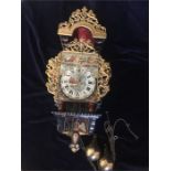 A Dutch wall mounted Ornate Clock