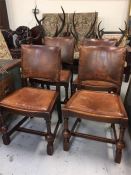 Set of four oak and leather dining chairs