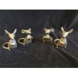 Four cast iron mice