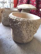 A Pair of Garden stoneware circular planters festooned with roses