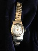 A 10K gold Longines ladies watch with replacement stainless steel strap