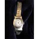 A 10K gold Longines ladies watch with replacement stainless steel strap