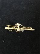 A gold brooch