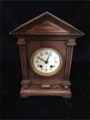 An Oak clock, tabernacle style