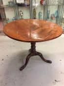 A tilt top round table