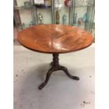 A tilt top round table