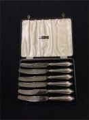 A boxed set of silver handled knives, hallmarked Sheffield