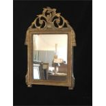 A Louis XVI gilt framed mirror