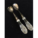 A pair of silver and glass handled salad servers, hallmarked Birmingham 1903-04, makers mark BB