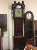 A Long case clock made by Crawshaw of Rotherham with a painted face plate.