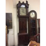 A Long case clock made by Crawshaw of Rotherham with a painted face plate.