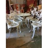 A Cast Iron garden table set with six chairs and a table