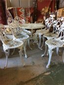 A Cast Iron garden table set with six chairs and a table