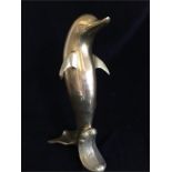 A large Brass Dolphin