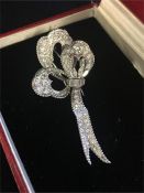 Diamond set platinum rope edged stylised ribbon bow brooch by Sterle of Paris. Dimensions 35 x