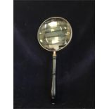 A silverplate 6" magnifying glass