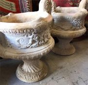 A pair of garden stoneware two handled urns