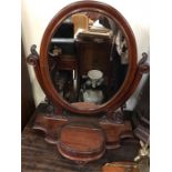 A Mahogany toilet mirror with storage in stand