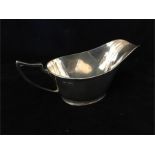 A silver sauce boat by Walker & Hall, hallmarked Sheffield 1934 (130g)