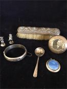 A selection of silver items to include a compact, spoon, brush etc.