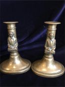 A pair of brass Shakespeare candlesticks