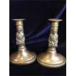 A pair of brass Shakespeare candlesticks