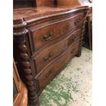 A Serpentine fronted three drawer chest of drawers