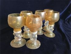 A set of six amber goblet style glasses