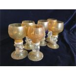 A set of six amber goblet style glasses