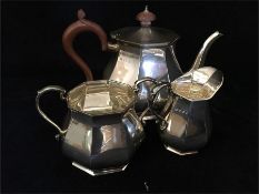 A Silver tea set to include teapot, sugar bowl and milk jug hallmarked Sheffield 1962, makers mark R