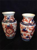 Two Imari vases on stands