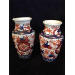 Two Imari vases on stands
