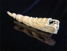 A worked Chinese ivory Dragon on stand