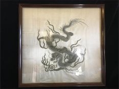 An antique Chinese silk of a Dragon, framed.