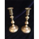 A pair of brass candlesticks