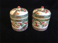 A pair of hand painted Chinese pots