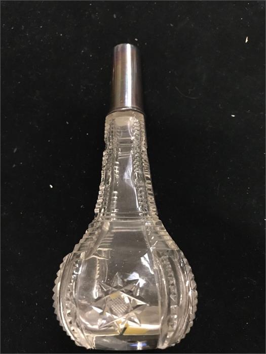 A hallmarked silver topped vase.