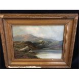 An oil on board of a highland scene