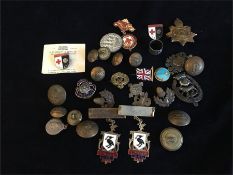 A selection of military badges and buttons