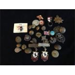 A selection of military badges and buttons