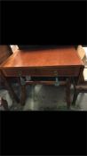 A drop leaf sofa table with two drawers