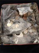 A Tin containing a large quantity of coins, including British pre-decimal coins and pennies, and