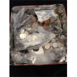 A Tin containing a large quantity of coins, including British pre-decimal coins and pennies, and