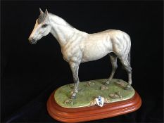 A Capodimonte grey horse on a plinth