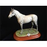 A Capodimonte grey horse on a plinth