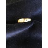 An 18ct gold ring (3.3g), missing stones.