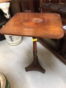 An incidental table with inlaid top